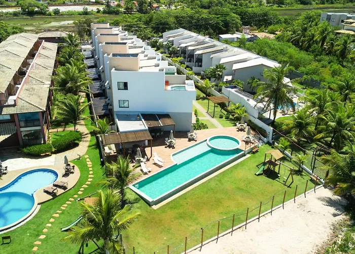Casa Turquesa Pé na areia Piscina infinita Pet friendly Condomínio fechado
